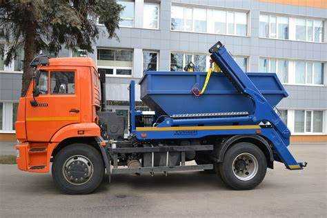 Как погрузчик грузит камаз