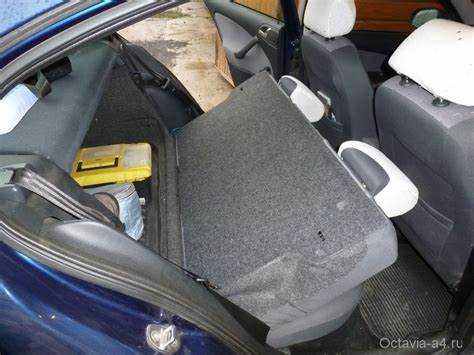 Как вернуть задние сиденья в исходное положение